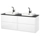 Modern white bathroom vanity with black countertop, two square bowls, black fixtures, sleek handles, and ample storage.
