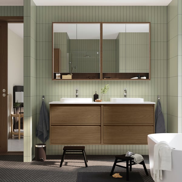 Modern bathroom ÄNGSJÖN vanity, large mirror, white sinks, storage, towels, stool.