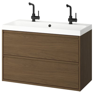 Modern bathroom vanity, ÄNGSJÖN, wall-mounted in dark wood with a white sink, two black faucets, minimalist design.