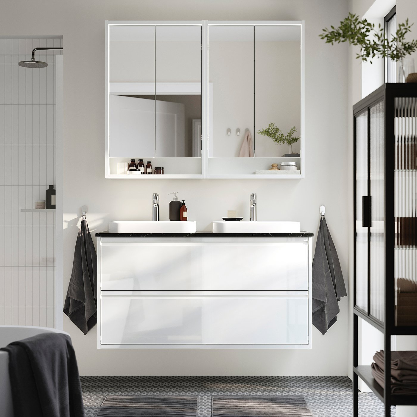 Modern white ÄNGSJÖN double vanity with glossy integrated handles, wall-mounted, with mirror cabinet and tile floor.