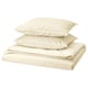 ÄNGSLILJA bed set in natural cream. Made of soft, breathable cotton. Includes folded duvet cover and two pillows.