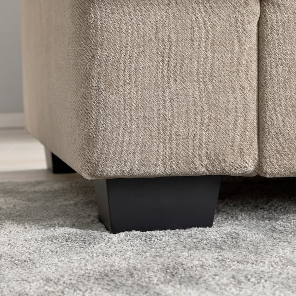 Close-up of soft, plush rugs texture and sleek furniture leg.