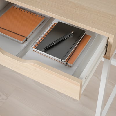 Drawer with notebook and pen