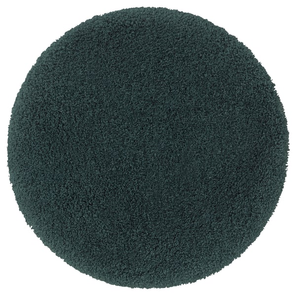 Round teal almtjarn bath mat, soft polyester, non-slip base.