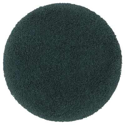 Round teal almtjarn bath mat, soft polyester, non-slip base.