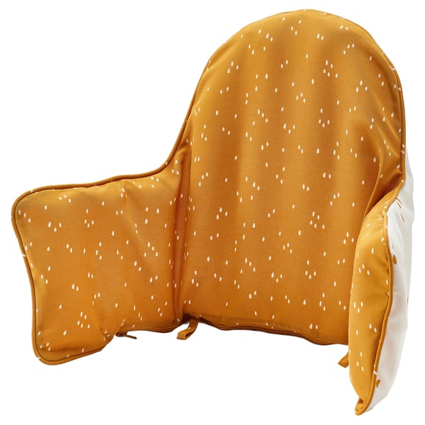 Depicts a yellow ANTILOP baby support cushion with white dots, designed for dining table support. It is inflatable, reversible, and washable.