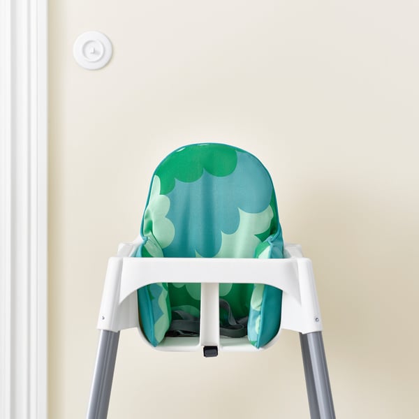 Baby highchair cushion with green, textured pattern for comfort and support.