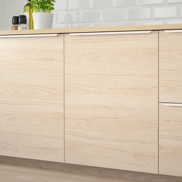 Kitchen cabinets with light ash wood effect and easy-clean surface. Visible hinges and great durability.