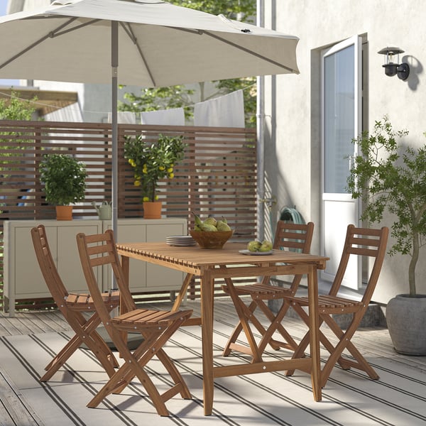 Wooden patio set with table and folding chairs, acacia wood, porch setup.