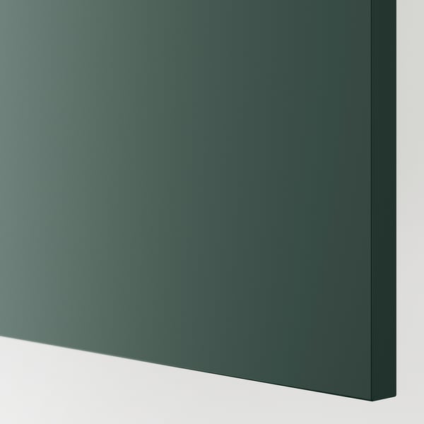 Close-up of a sleek, dark grey-green cover panel, smooth and reflective, showcasing its uniform finish and high-quality construction.
