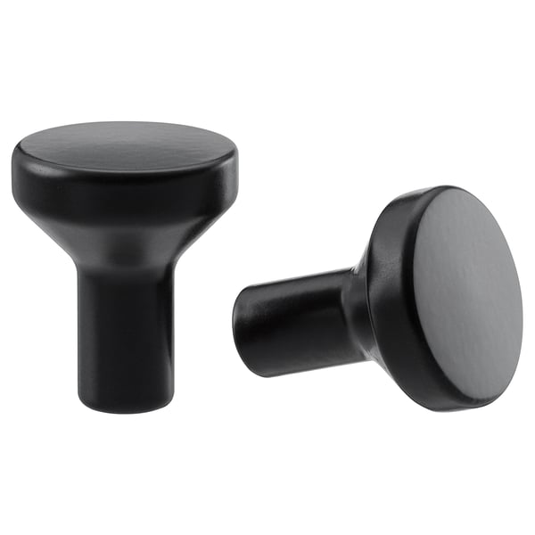 Two black, round, modern cabinet knobs with clean lines.