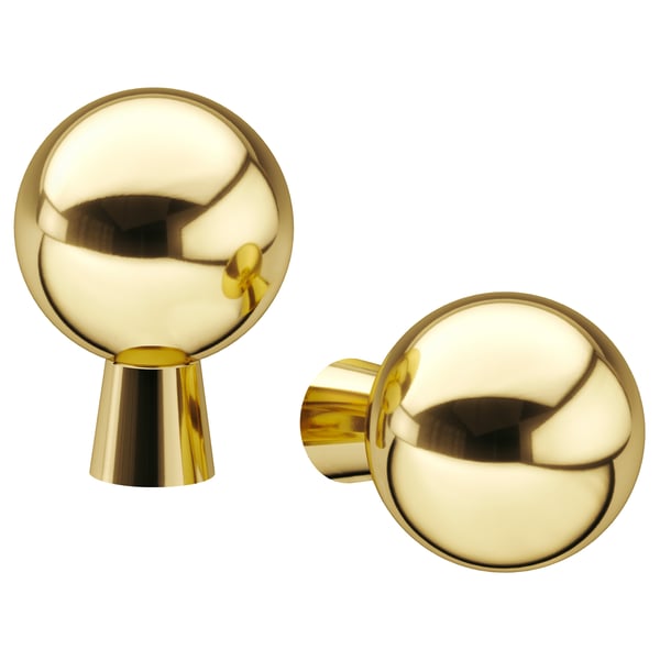 Two gold spherical BAGGANÄS knobs with clean lines and modern design, one with a stem, both brass-plated.