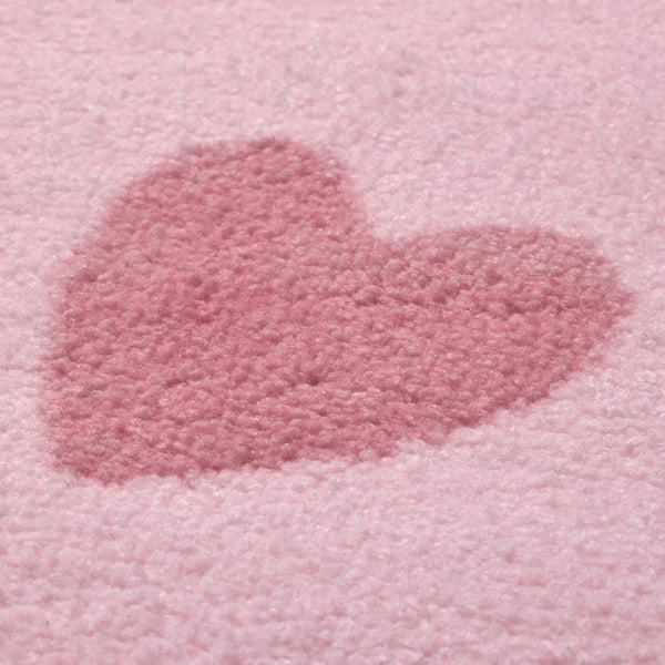 Soft, plush pink rug close-up, showing quality texture of recycled polyester fibres.