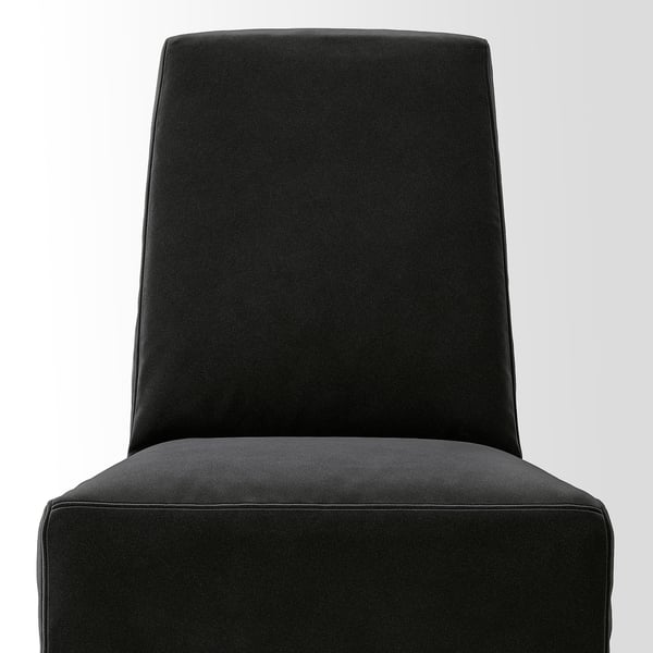 Protective, modern chair cover; smooth, durable fabric; even stitching; neat finish; built for comfort.