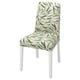 BERGMUND chair with tropical leaf print seat and back, white legs.