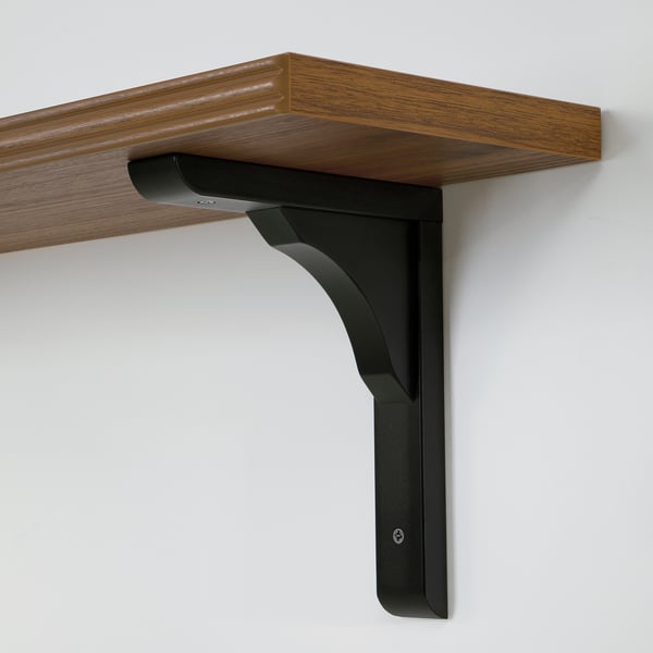Wooden shelf with angled black metal bracket. Handcrafted quality finish, mounted on wall.