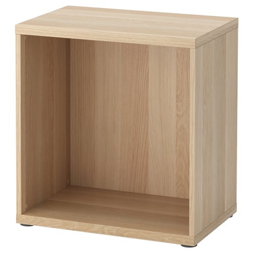 A BESTÅ wooden storage unit in light oak colour, featuring an open rectangular design with adjustable feet.