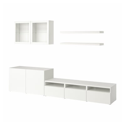 This image shows a white BESTÅ furniture set with tv bench, wall shelves, and glass-door cabinets.