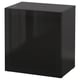 A black BESTÅ storage unit with a sleek, modern design featuring a glass door.