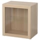 A light wooden BESTÅ cabinet with a single glass door and an open shelf. Its a simple, rectangular storage unit.