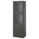 Tall dark grey BESTÅ cabinet with glass doors and drawers.