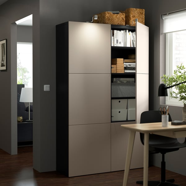 A modern storage unit with adjustable shelves and soft-closing doors, positioned in an office setting.