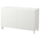 White BESTÅ storage unit: modern rectangular design with two doors, wooden legs, and clean lines for versatile decor.