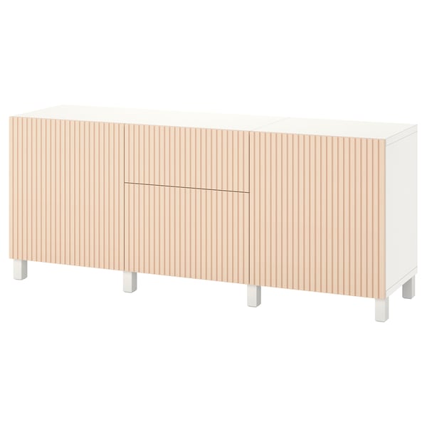 A white BESTÅ sideboard with light wooden doors, featuring a modern design with adjustable shelves and drawers.