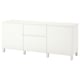 An ikea BESTÅ white sideboard with three sections, featuring shelves and drawers.