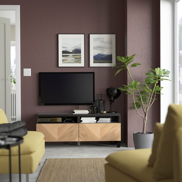 Modern living room with BESTÅ tv unit and colourful decor.