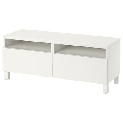 A white BESTÅ tv bench with open shelves and drawers for storage and cable management.