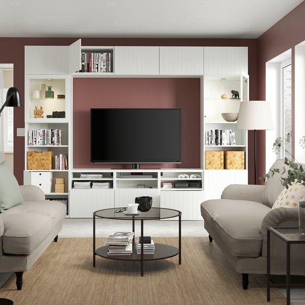 Modern living room with BESTÅ tv unit, adjustable shelves, drawers, cable management, sofas, and glass-top coffee table.