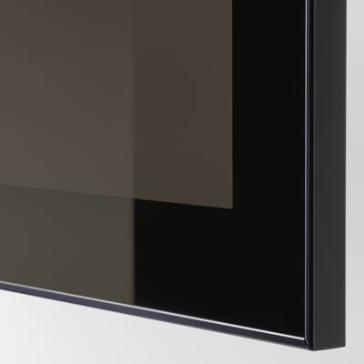 Modern black cabinet with sleek, reflective glass door, showcasing high-quality design and finish.
