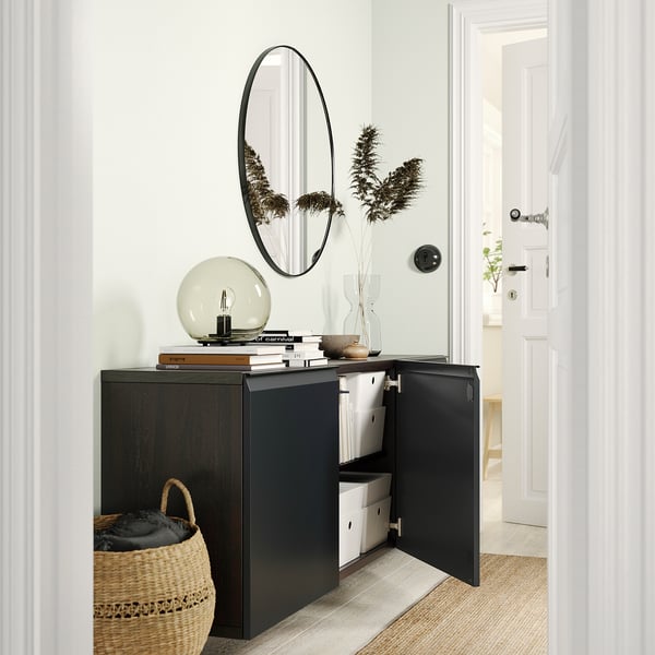 Modern hallway with BESTÅ storage, mirror, dried flowers, and basket. Or, for even fewer characters: hallway with BESTÅ, mirror, flowers, basket.