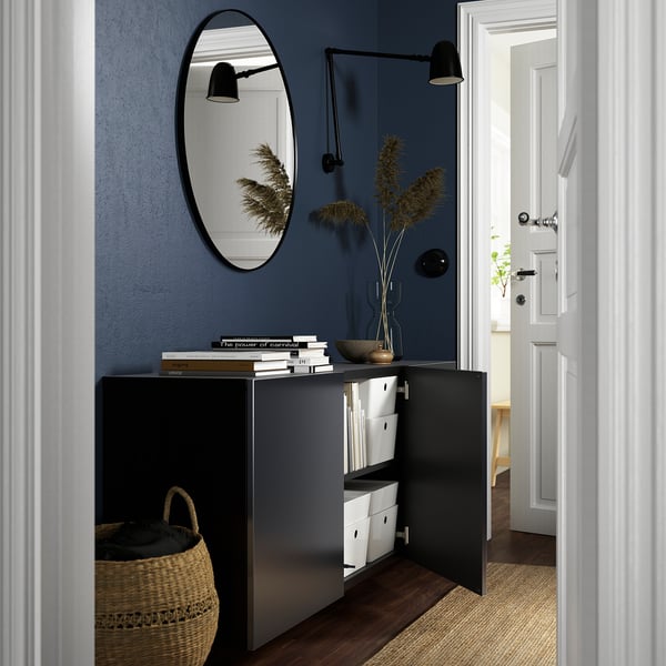 Modern blue wall-hung cabinet with adjustable shelves and mirror, offering practical storage and an airy feel.