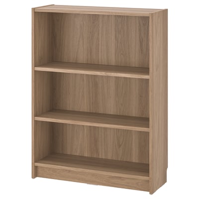 A BILLY bookcase in oak effect. It three adjustable shelves and a simple, rectangular design suitable for various storage needs.