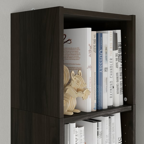 Dark wood bookshelf with books and decorative item.