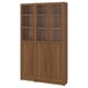 This image a BILLY bookcase in brown, crafted from particleboard and wood veneer. It is tall and rectangular with glass doors and wooden panels.
