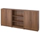 A BILLY bookcase in brown, featuring a mix of open and closed storage with multiple shelves.