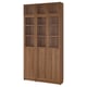 Tall wooden BILLY bookcase with glass doors.