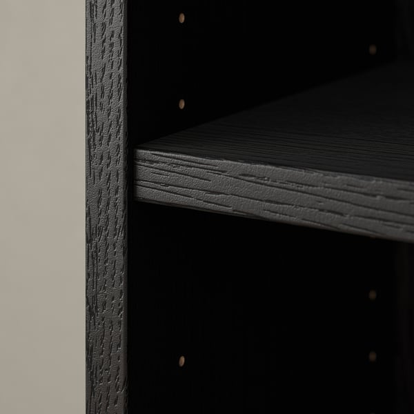 Dark wooden bookcase corner, showcasing smooth, textured wood grain and sleek, modern design.
