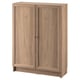BILLY bookcase: light brown, wooden finish, rectangular, two closed doors, simple design.
