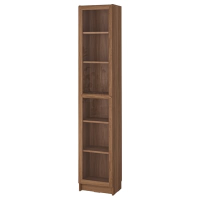 A BILLY bookcase, tall and brown, made of wood with multiple shelves for storage.