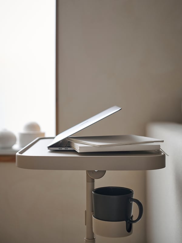 BJÖRKÅSEN laptop stand with notebook and mug holder, adjustable workspace.