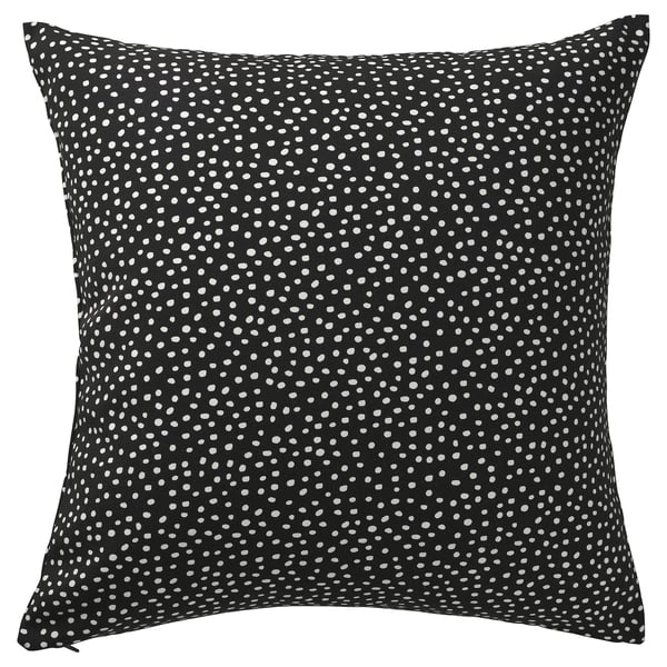 Square black throw pillow with white polka dots, featuring a zip closure.