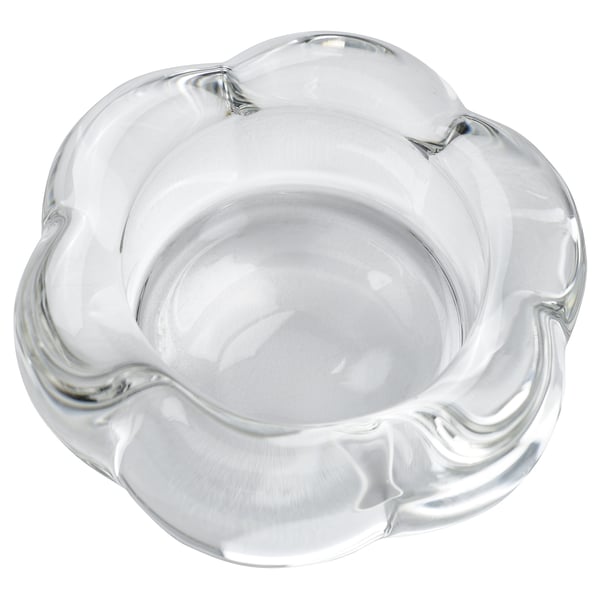 Clear glass tealight holder, flower-shaped, modern design.