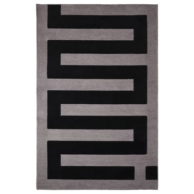 BLÅSKATA grey rug with black geometric shapes, rectangular, soft, stain-resistant, anti-slip.