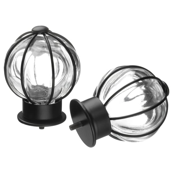 Two spherical glass finials with black metal frames and bases, styled for curtain rods.