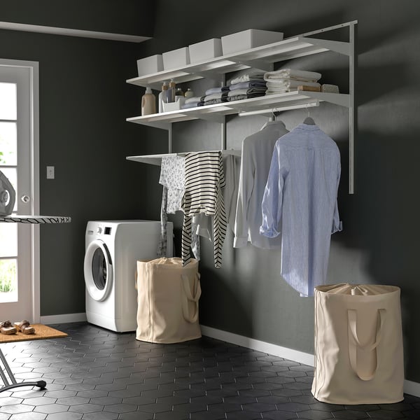 BOAXEL wall-mounted laundry system with shelves, hanging rods, and bags.
