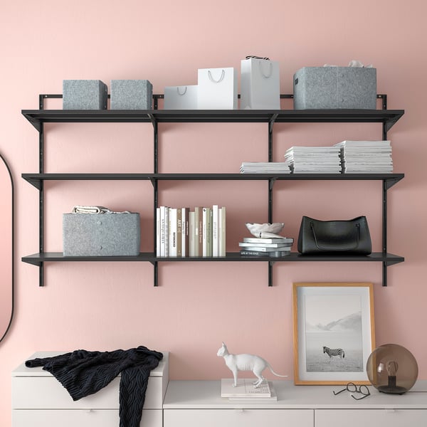 Modern wall-mounted shelves with containers, books, and decorative items arranged neatly, highlighting organisation and storage capabilities.